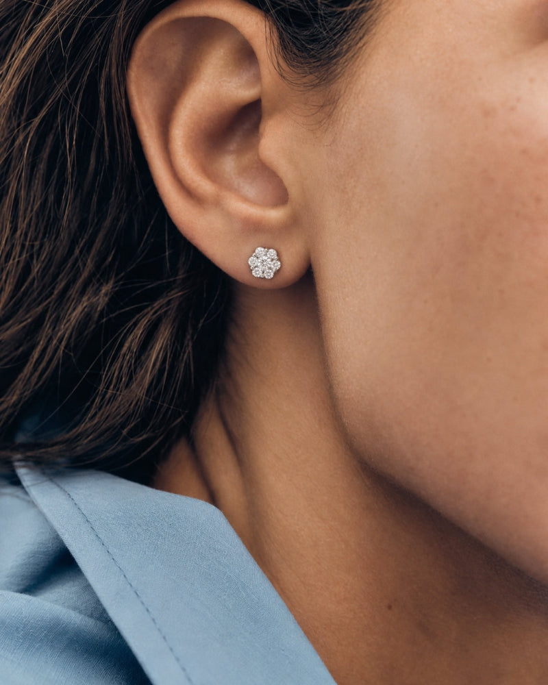 Flower diamond stud earrings worn