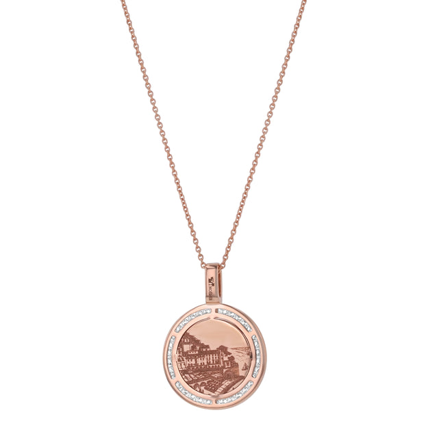 Rose gold necklace with a round pendant on a white background