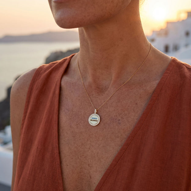 Woman wearing a necklace with a sunset in the background
