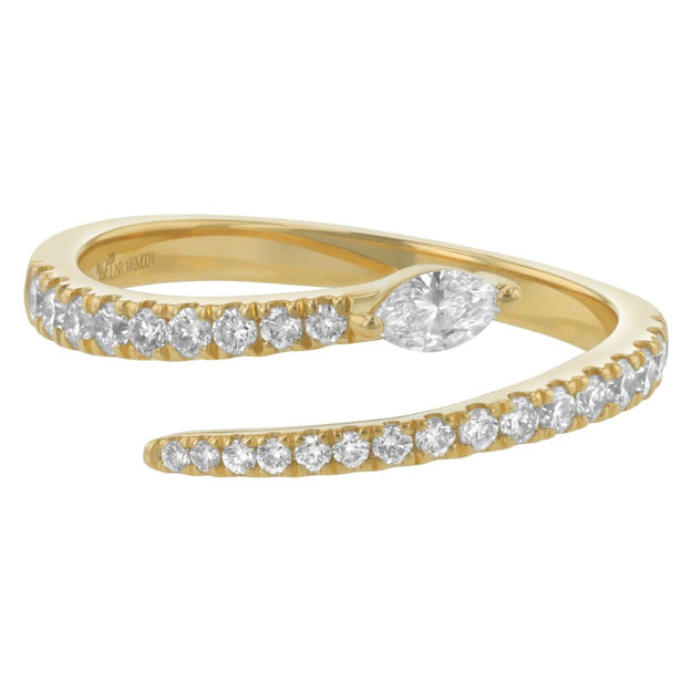 Gold ring with diamond accents on a white background