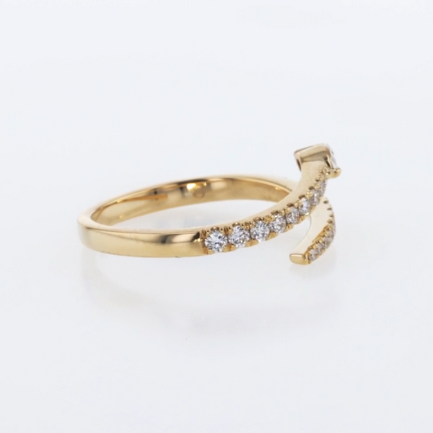 Gold ring with small diamonds on a white background